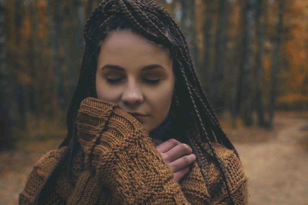 Calm young woman in a woodland