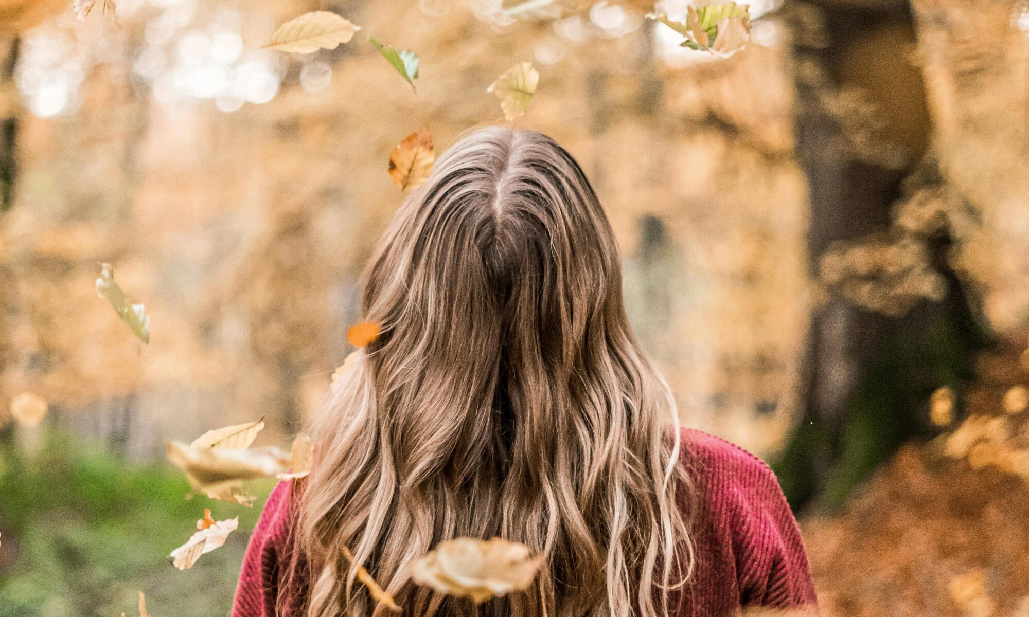 Girl in autumnal woodland